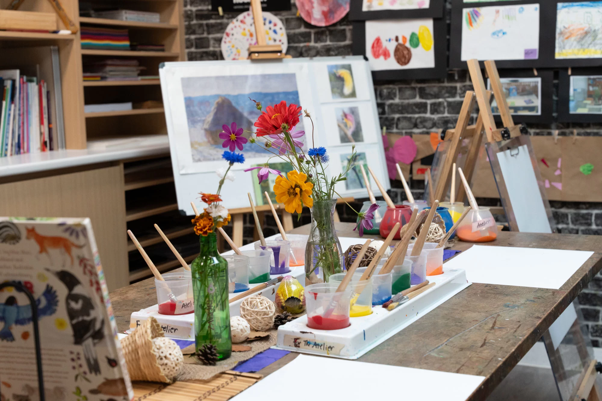 The Art Studio at Fairfield ELC with easels, paints and children's artwork